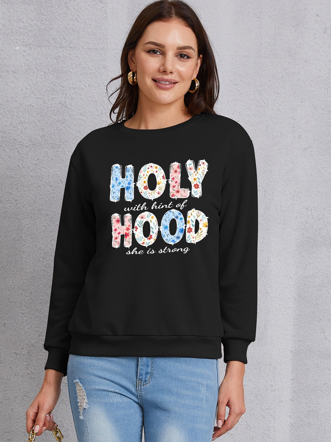 HOLY WITH HINT OF HOOD SHE IS STRONG Round Neck Sweatshirt