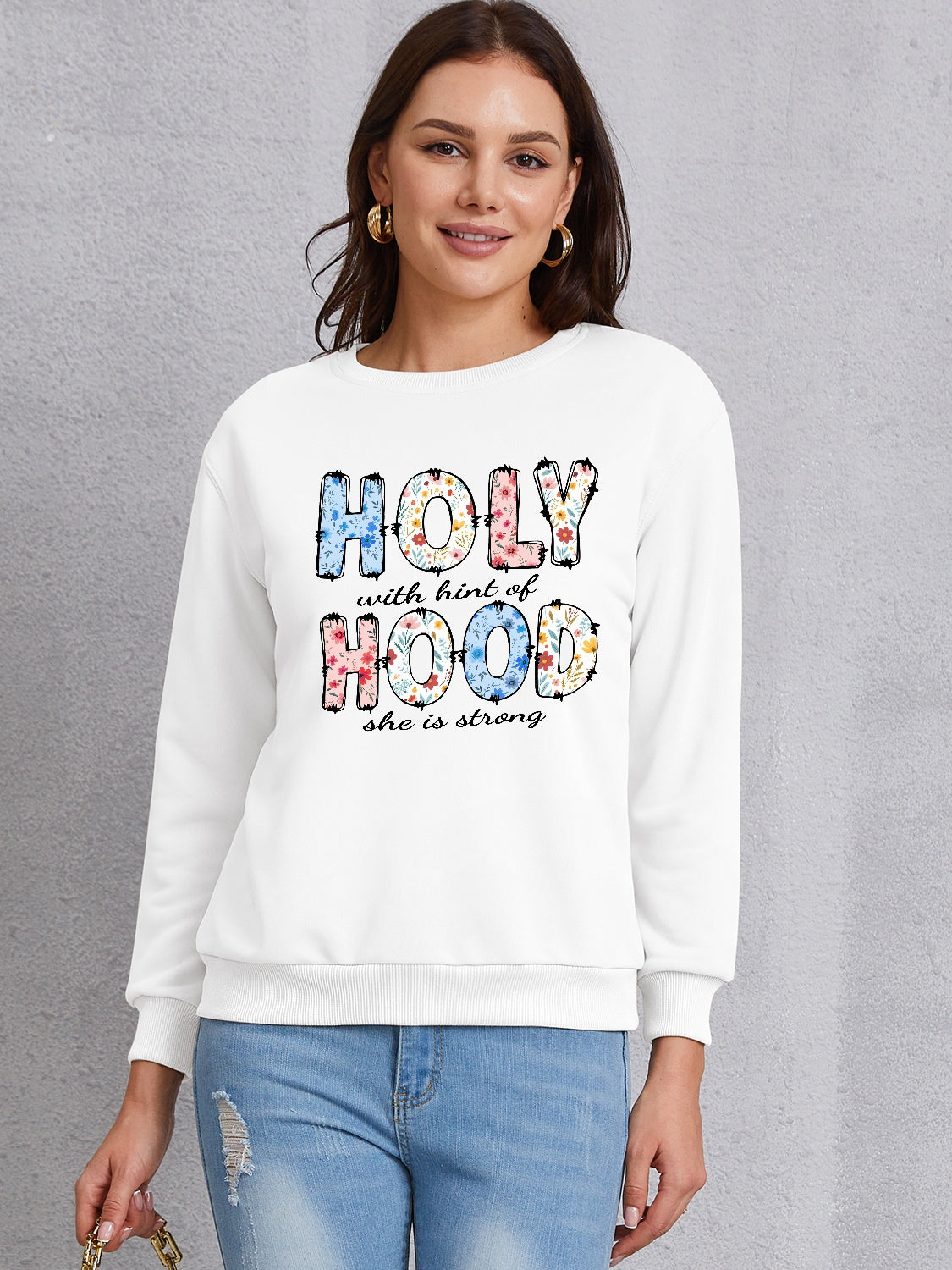 HOLY WITH HINT OF HOOD SHE IS STRONG Round Neck Sweatshirt